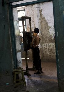 A man receives a chest X-Ray during the admission process at a hospital in India. © David Rochkind